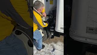 How to tilt the cab on an Isuzu truck