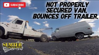 Not properly secured van, bounces off trailer.