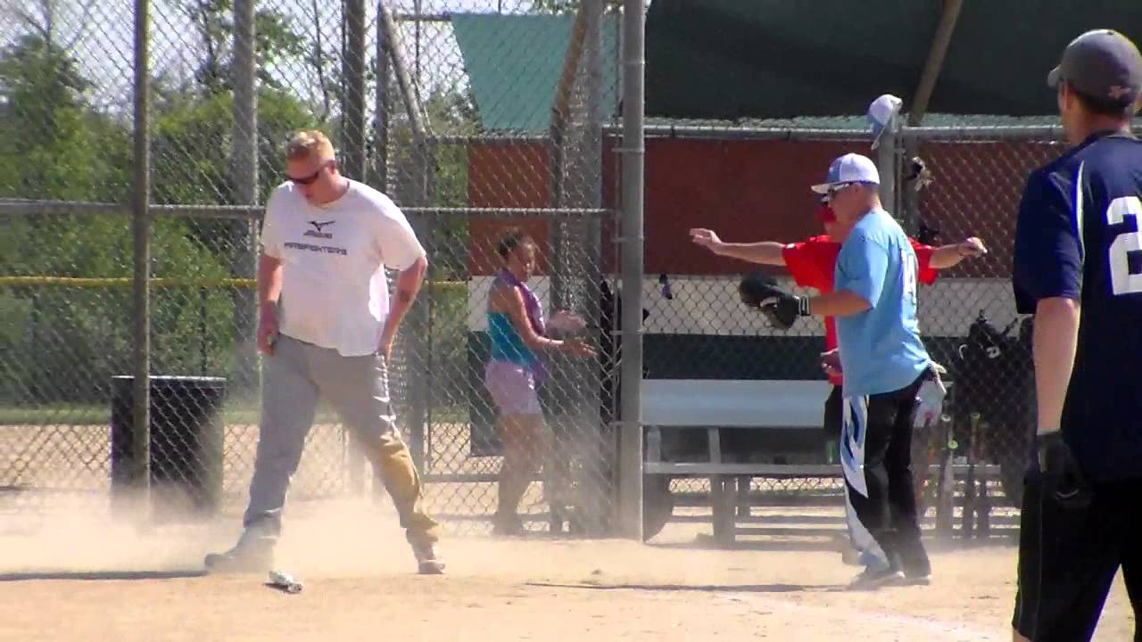 Crew player slides home on sacrifice fly vs. Tyson Builders in Canton
