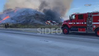 Bonsall : Car crash fire spreads to nearby vegetation on I-15, SIG Alert issued