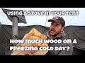How much fuel does a wood burning stove use on a cold day?