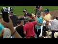 Fan catches bat flying into the stands