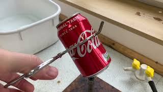 Crushing coke can with atmospheric pressure