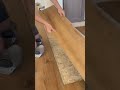 Installation of wooden plank panels on house room floor #shorts