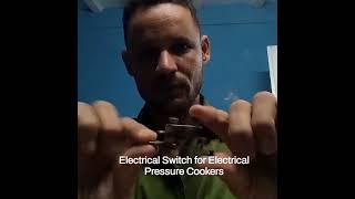 Alexander Gibson shows an electrical pressure switch for electric pressure cookers