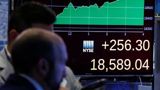 Stocks jump after Trump election surprise, and other MoneyWatch headlines
