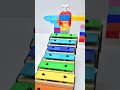 *Marble Run & Xylophone* The marble rolled across the xylophone, creating music.