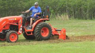 Kubota b2650 running the land pride rta1258 pto tiller. tilling virgin
ground for food plot.