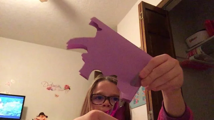 Making a paper snowflake with Pauline Stevens.