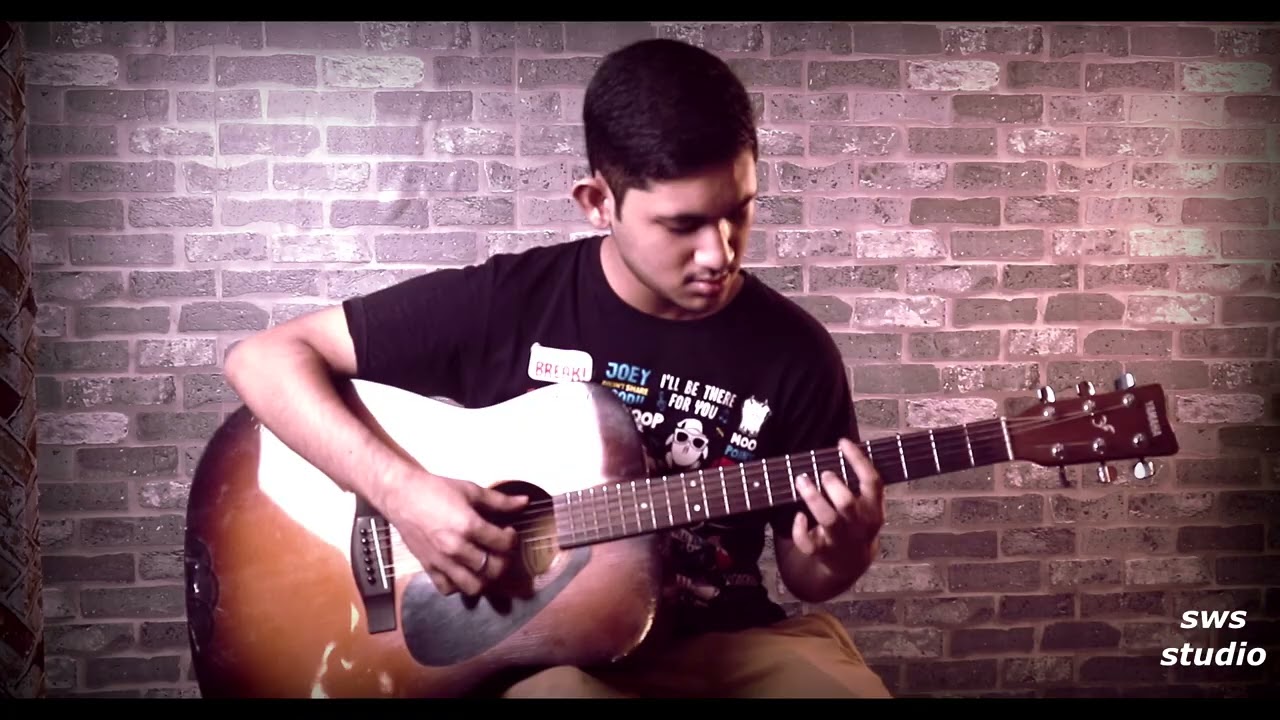 Bornabh Playing Finger Style Guitar