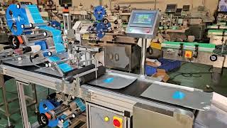 automatic top and bottom labeler for plastic pouches #labelingmachine #equipment