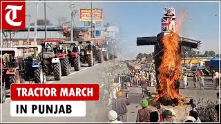 Farmers take out tractor march at various places in Punjab, burn effigies