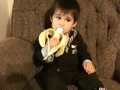 One year old baby eating banana