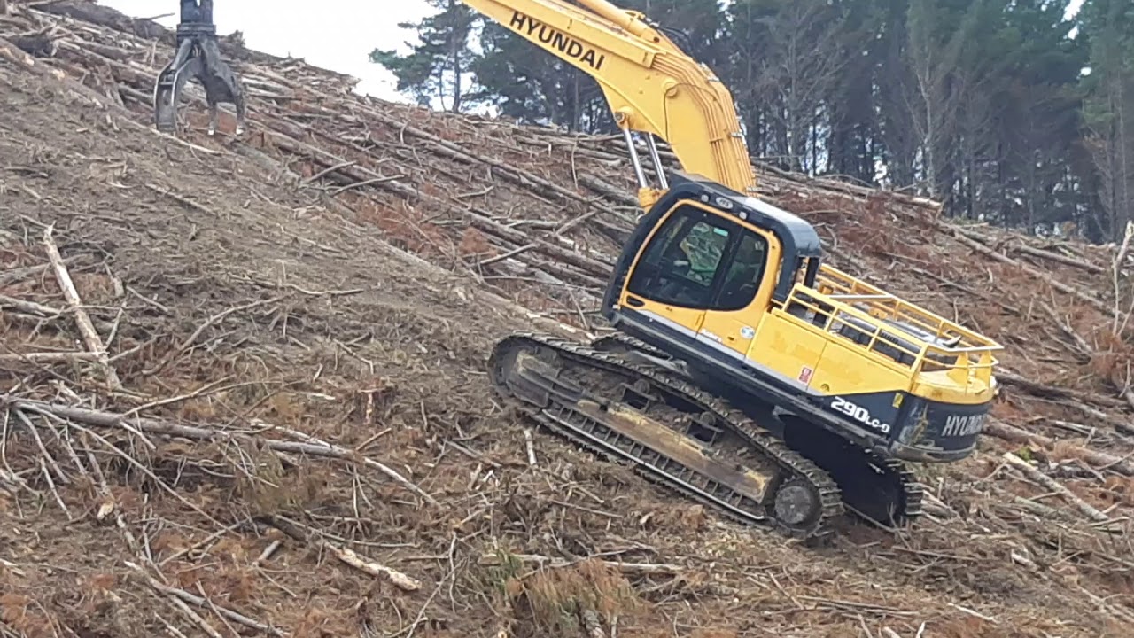Forestry excavator climbing a steep hill YouTube