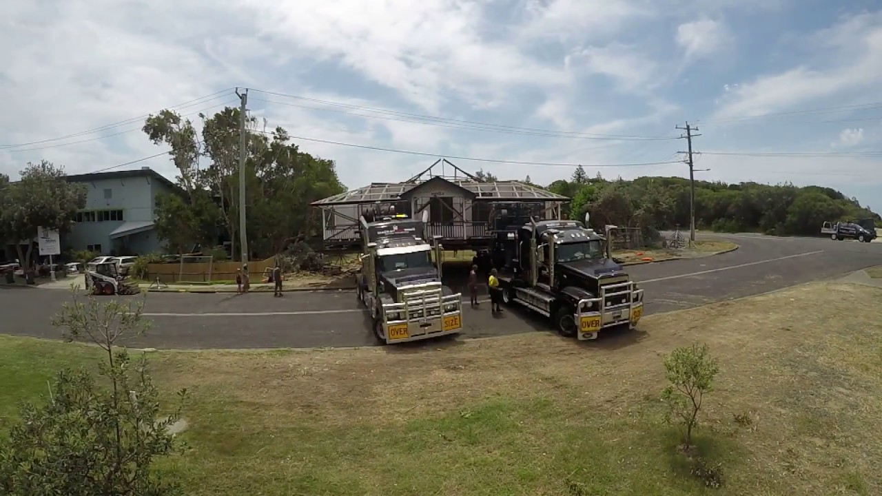 Australian House Removals - 4 section home spun into place with 2 Mack Trucks