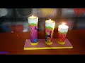 velas navideñas hechas con cartón de cañón de papel.