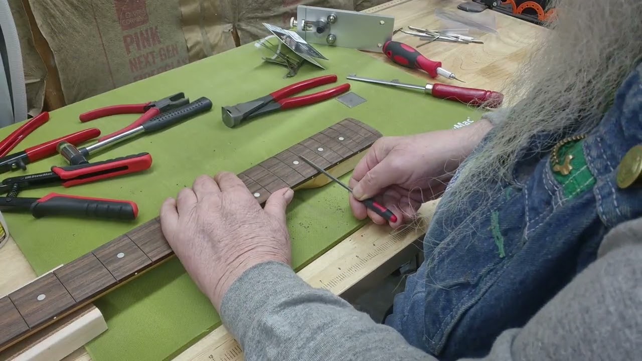 Installing frets on the bass neck