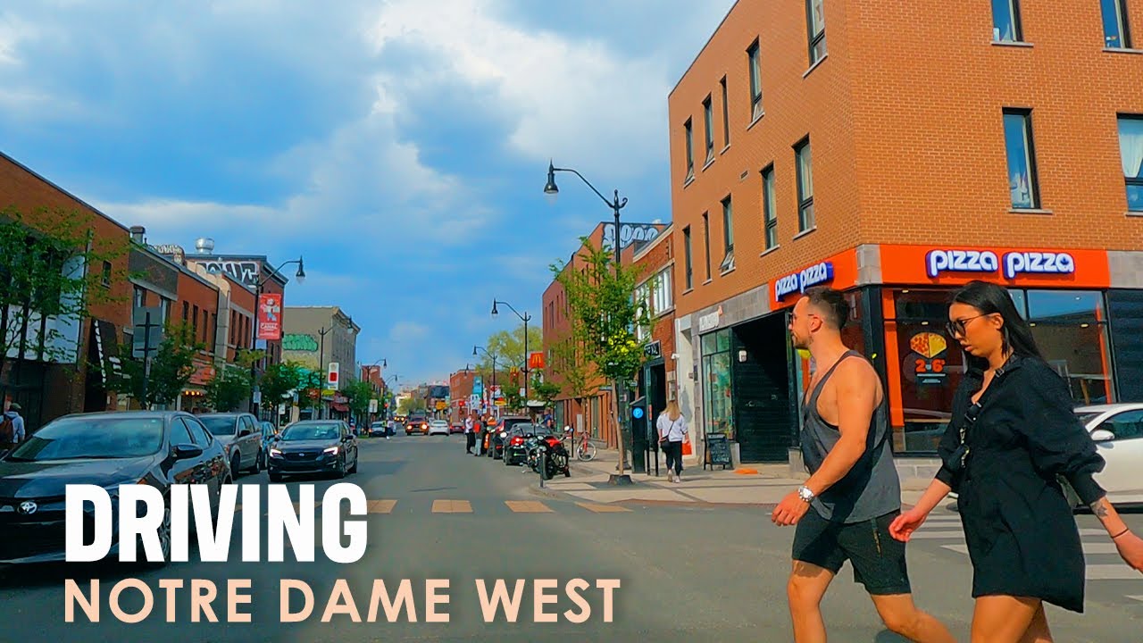[ 4K Video ] Driving across the old architecture of Rue Notre Dame Montreal
