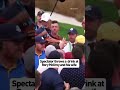 Rory and his wife Erica react to a beverage being thrown at them on Saturday at the Ryder Cup