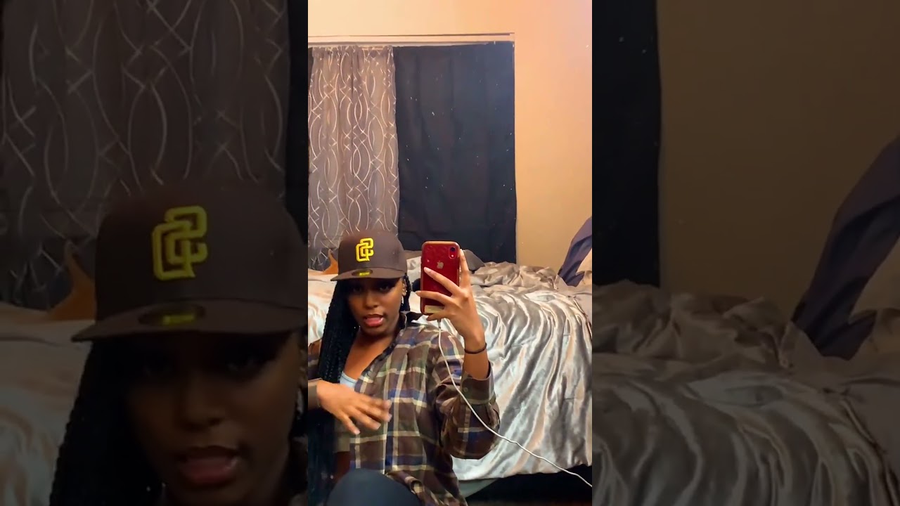 Confident Woman Delivers Catchy Rap Verse in Bedroom Selfie
