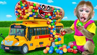 Kiki Monkey gets trouble when playing with Colorful M&M Candy School Bus   | KUDO ANIMAL KIKI