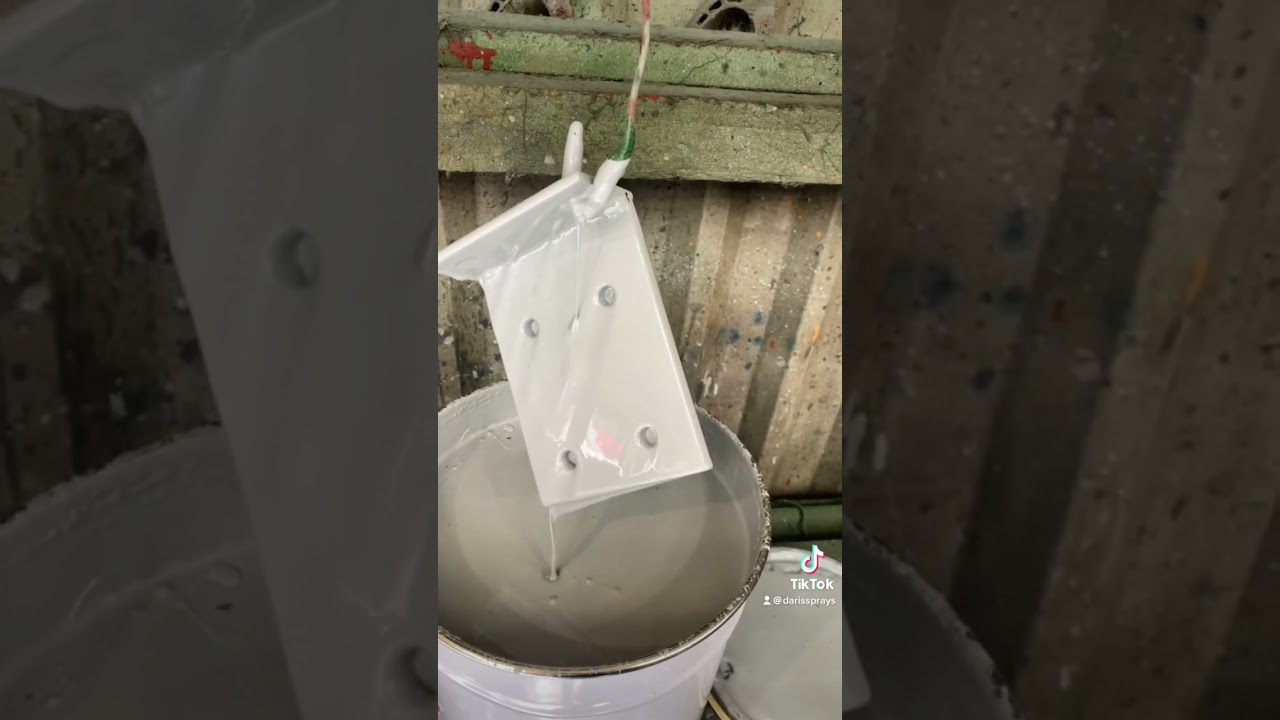 Dip painting steel brackets in grey primer