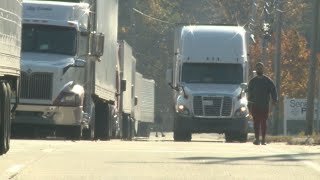 Dozens of trucks at a standstill outside Walmart Distribution Center in Lewiston
