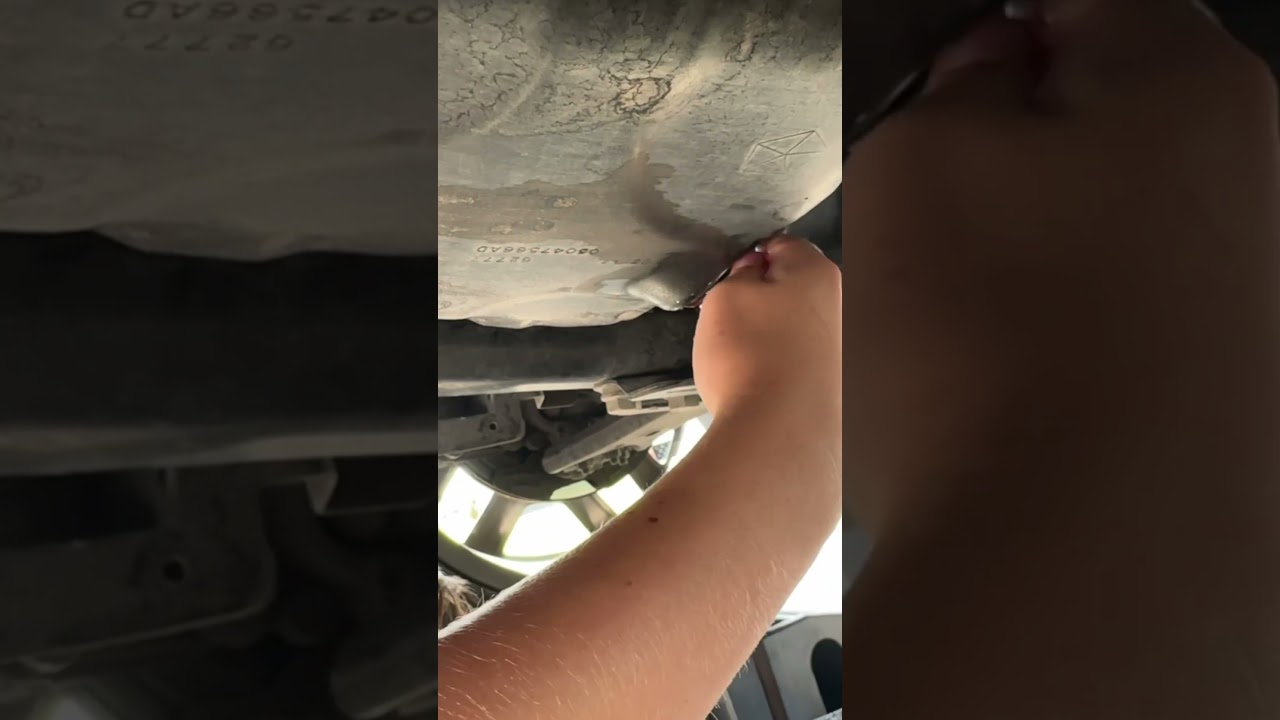 Teaching the kids to change the oil in a vehicle 🚗