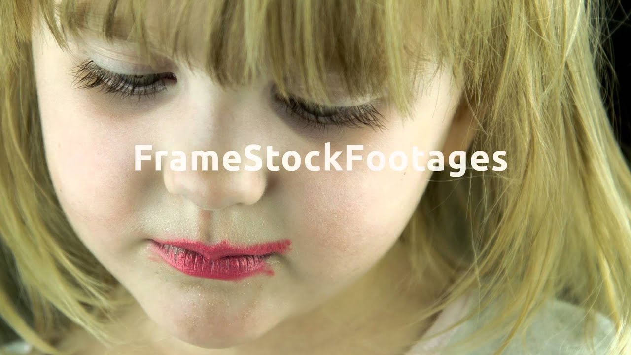 The little cute girl makes up lips with red lipstick YouTube