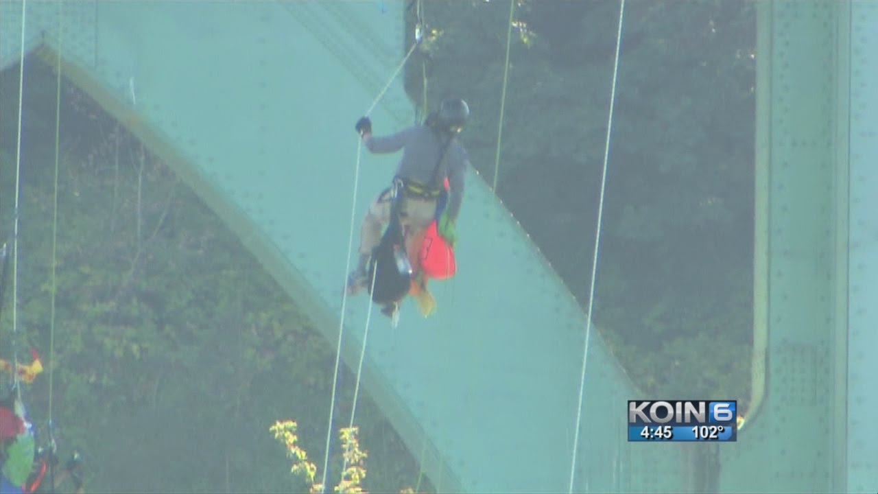 Rappelling protesters being lowered from St. Johns Bridge - YouTube