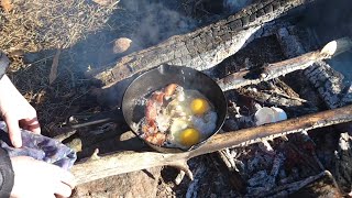 Solo camping on a lake: Cooking breakfast