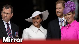 Cheers for Meghan and Harry drown out lone boos at Jubilee service
