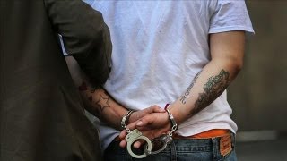 Holder Unveils Overhaul to Cut Inmate Population