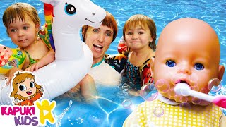 Baby Annabell \& baby dolls at the swimming pool. Kids playing toys \& family fun video for kids.