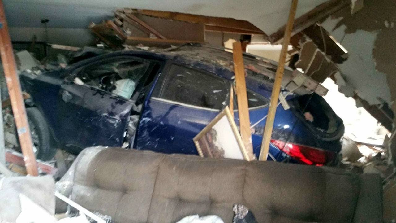 2 children injured when car crashes into apartment building - YouTube