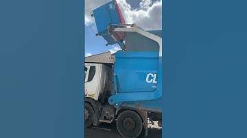 Cleanaway Front loader picking up a bin￼
