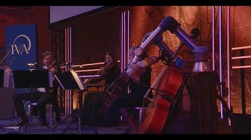 Robot performs cello piece specially composed by the world-renowned composer Jacob Mühlrad