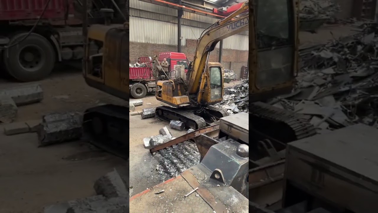 packing of scrap iron ore and iron plate in a scrap factory. 