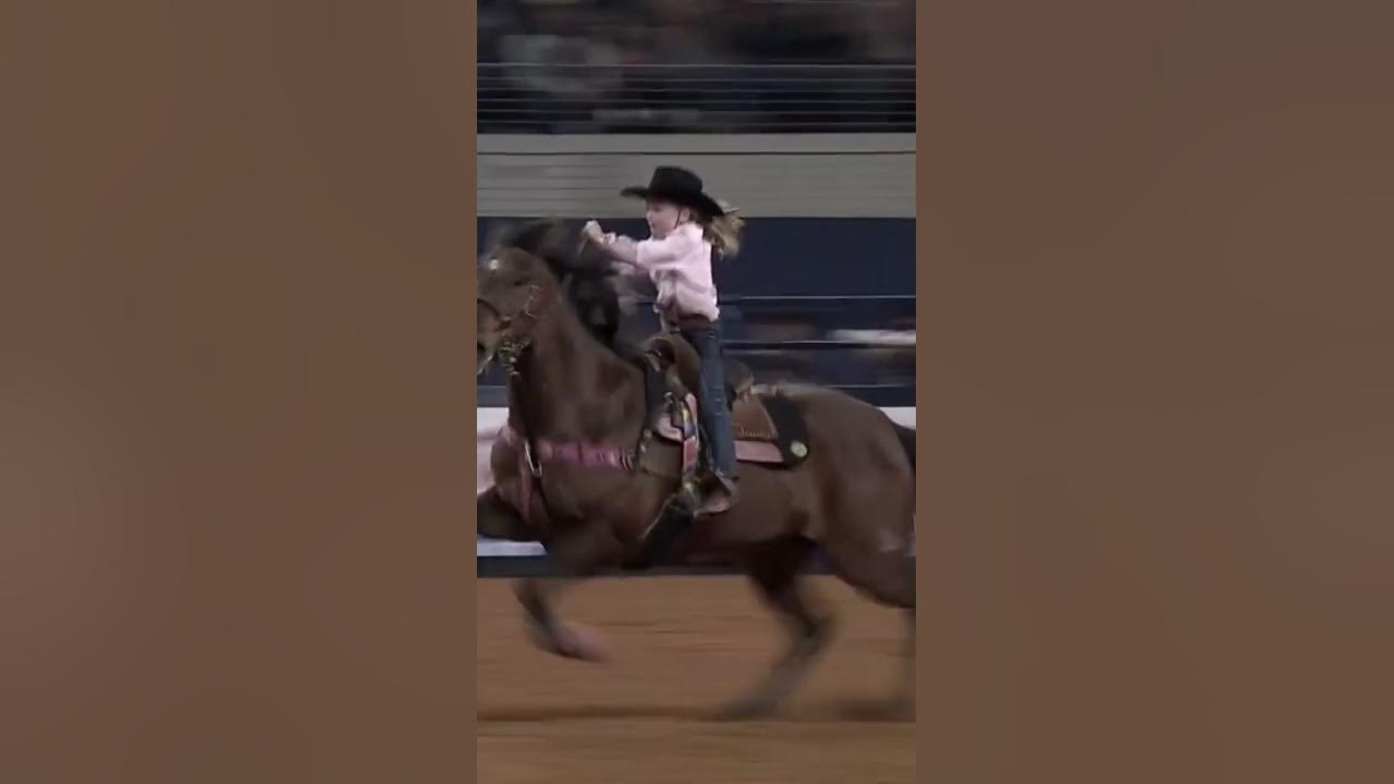 Barrel racer at 7 years old competes with the pros.