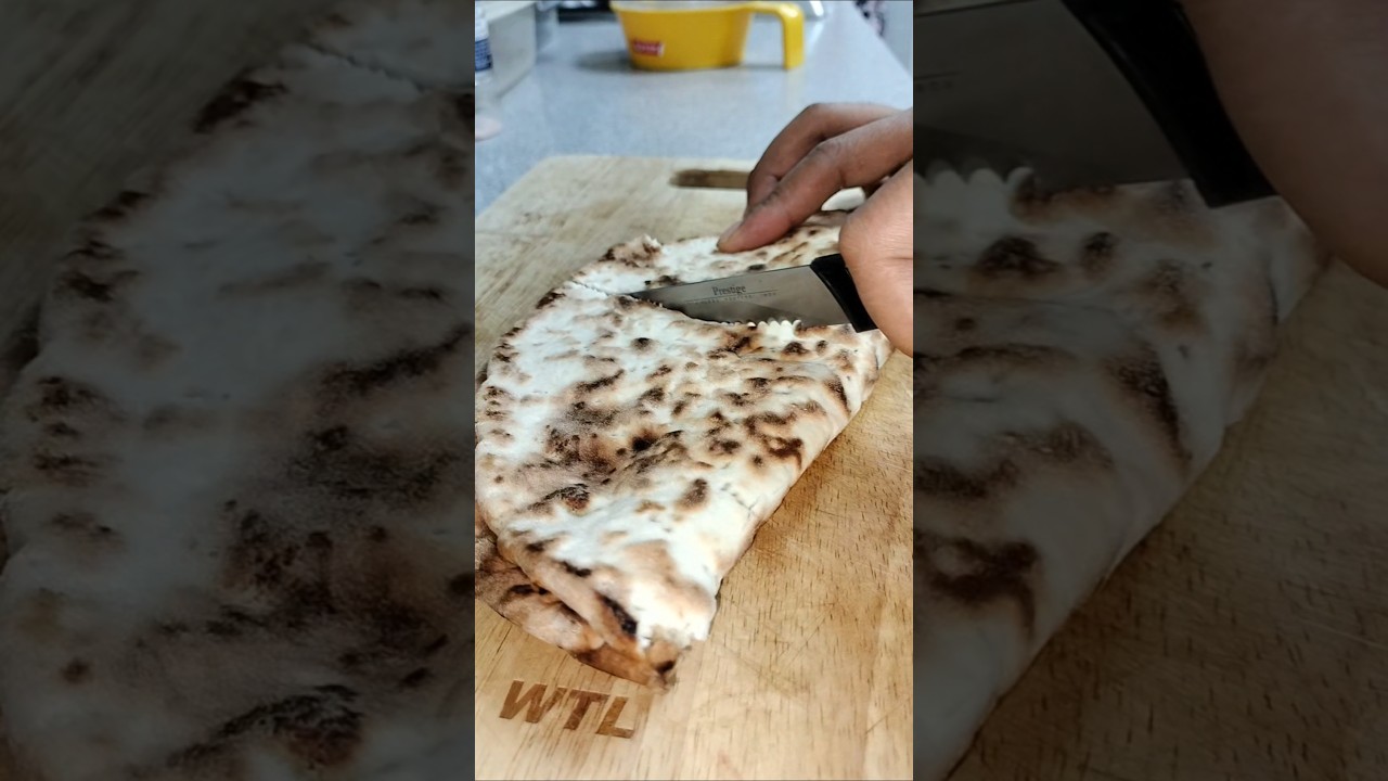 cutting Arabic bread with meat