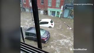 MAY 27: Floodwaters rage in Ellicott City, MD, sweeping away cars