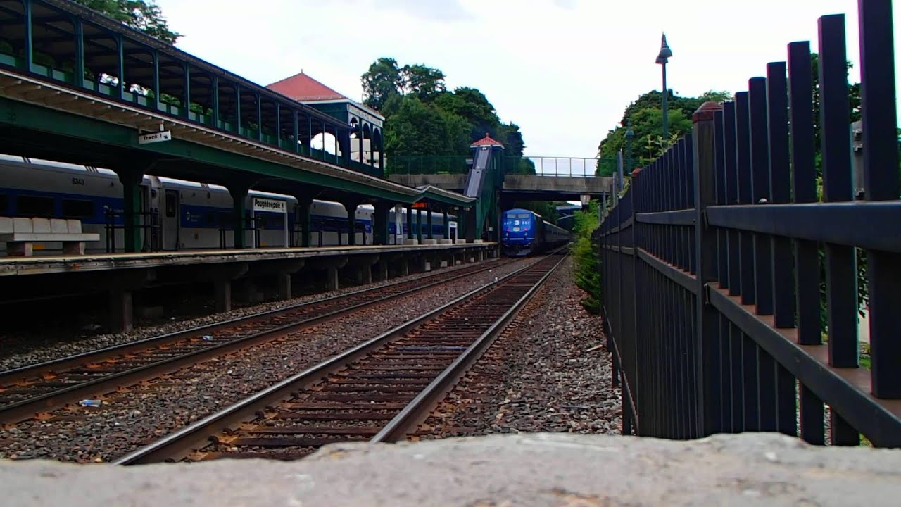 MTA Metro North Railroad P32AC DM 207 leaves while AMTRAK P42AC 702 enters Poughkeepsie
