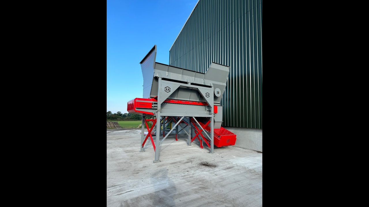 BAF-600DC Semi Automatic dual bagging system with robotic palletizing robot.