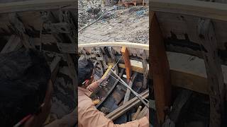 How to repair an old boat with a primitive wooden drill machine
