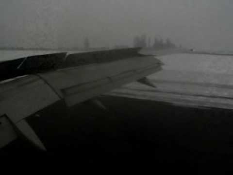 Hear the passengers clap as the Boeing 757 touches down in Almaty in mid-winter.