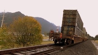 BNSF Double header with containers double-stacked thunders past Bonneville Dam (2 of 2)