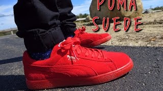 red pumas suede on feet