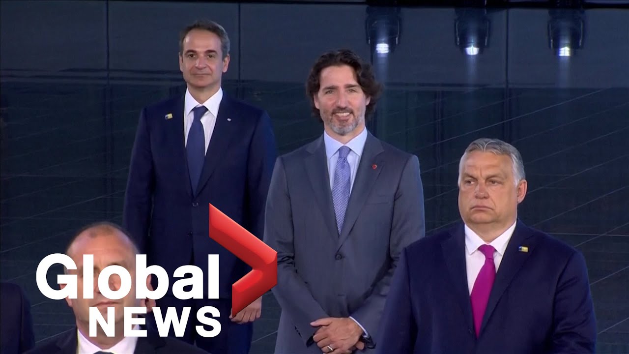 NATO leaders pose for "family photo" at summit in Brussels - YouTube