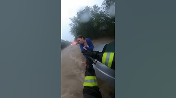 Firefighter Saves Woman From Raging Floodwaters