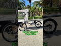 Cargo bike per trasportare i bambini con parapioggia installato – Taga in azione